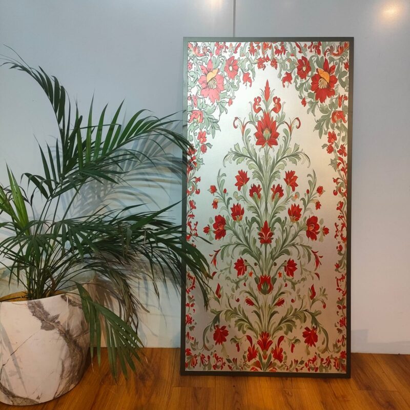 Rectangular framed artwork with a red floral design on a silver background.
