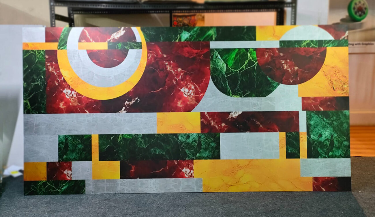 Large-format abstract print featuring geometric shapes and marble textures in vibrant colors.