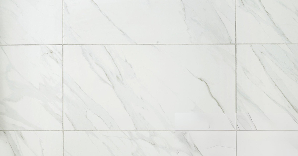 White marble-look tiles with gray veining.