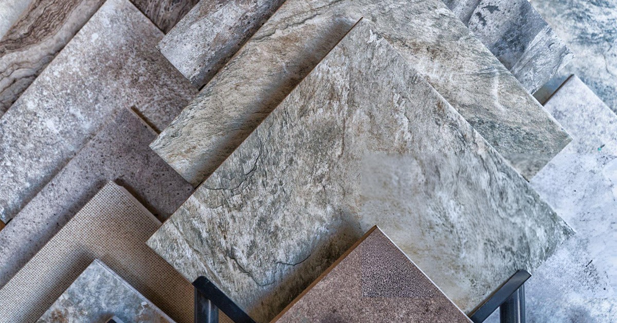 Assortment of gray ceramic tiles with varying textures and finishes.