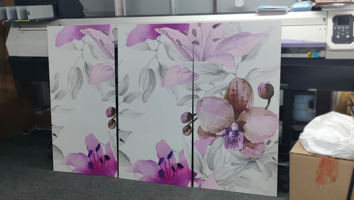 A close-up image of a ceramic tile with a vibrant floral design in shades of pink and purple. this printing is done by stampadolce. this is printed by UV Digital machine.