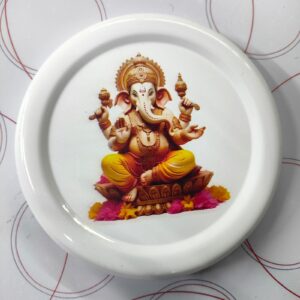 A white metal lid with a printed image of Lord Ganesha.